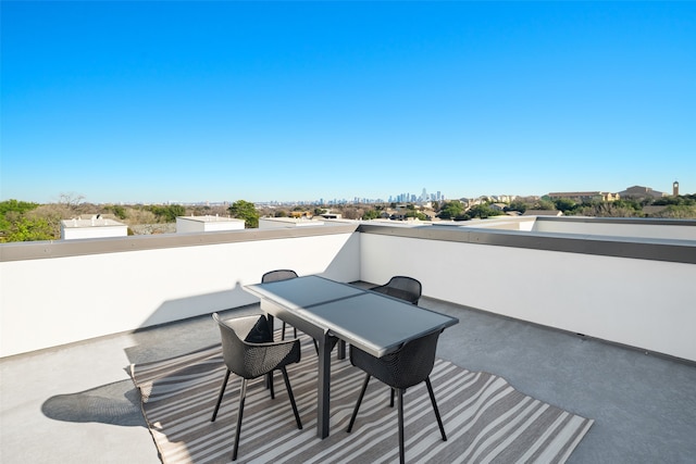 view of patio featuring a balcony