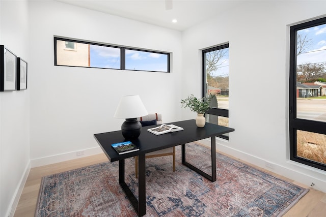 office featuring recessed lighting, ceiling fan, baseboards, and wood finished floors