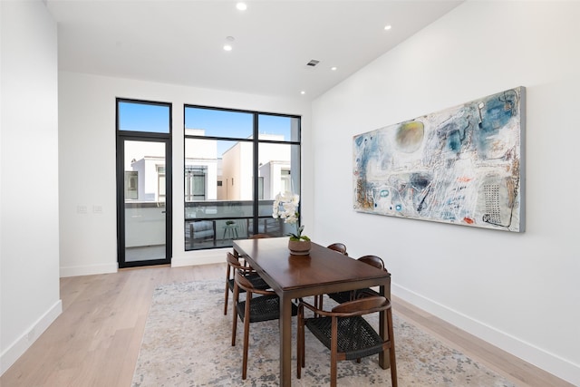 dining space featuring light hardwood / wood-style floors