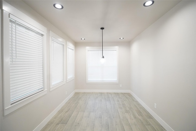 unfurnished dining area featuring light hardwood / wood-style floors