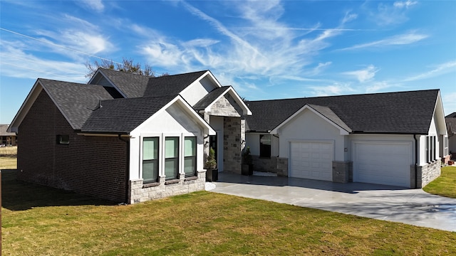 view of front facade with a front yard and a garage