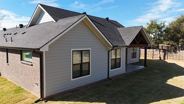 view of property exterior featuring a lawn