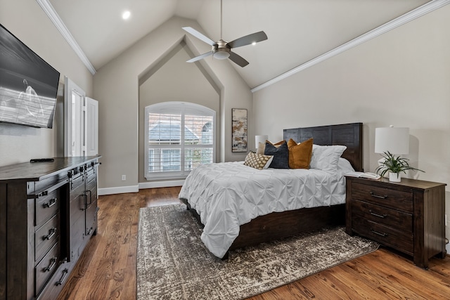 bedroom with hardwood / wood-style flooring, ceiling fan, ornamental molding, and high vaulted ceiling