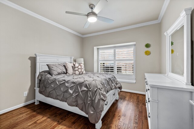 bedroom with ceiling fan, crown molding, and dark wood-type flooring