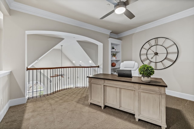 carpeted office with ceiling fan, built in features, and ornamental molding