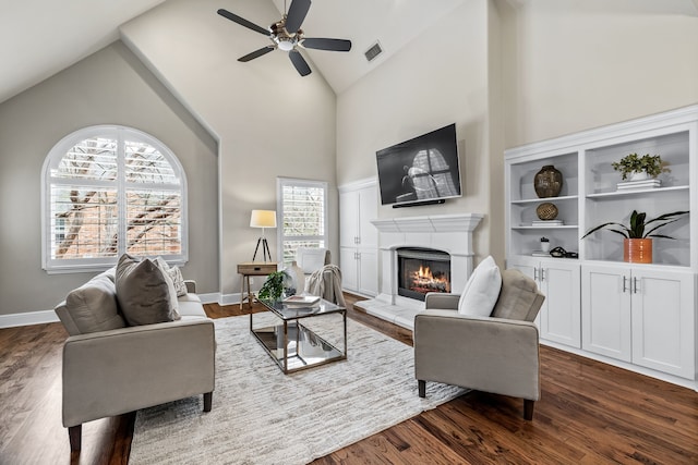 living room with ceiling fan, high vaulted ceiling, and dark hardwood / wood-style flooring