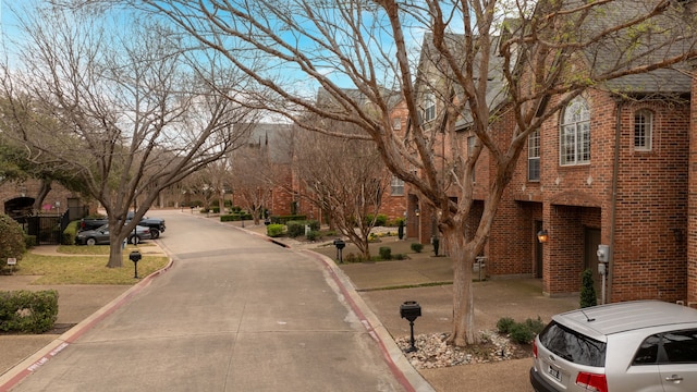 4141 Towne Green Cir, Addison, TX 75001 - view of concrete street featuring curbs