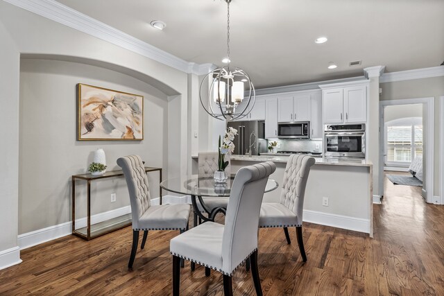 4141 Towne Green Cir, Addison, TX 75001 - dining space featuring a chandelier, ornamental molding, dark wood-type flooring, baseboards, and recessed lighting