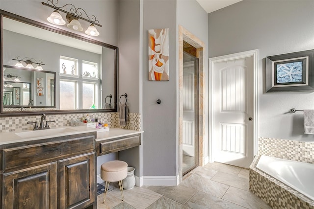 bathroom with a bath, vanity, and backsplash