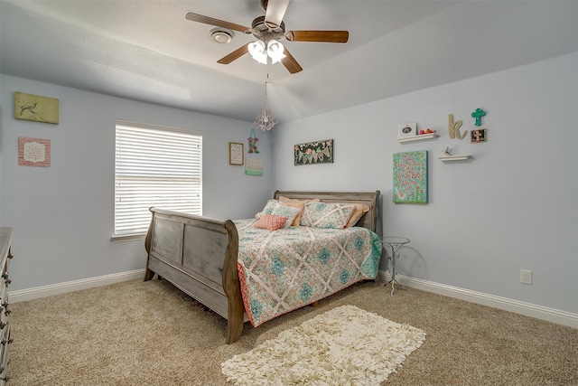 bedroom with carpet floors, vaulted ceiling, and ceiling fan