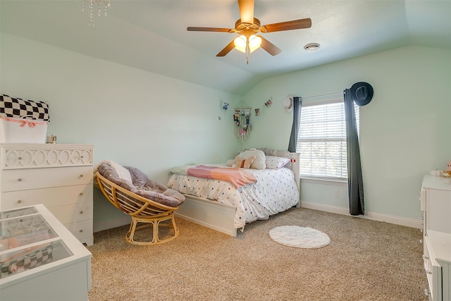 bedroom with light carpet, vaulted ceiling, and ceiling fan