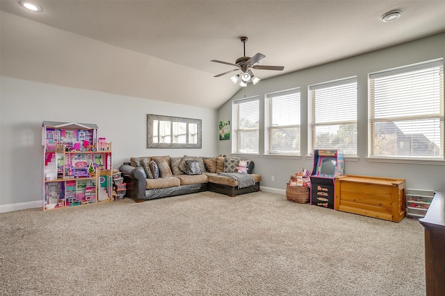 living room featuring carpet flooring, ceiling fan, and vaulted ceiling