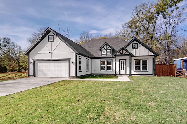 tudor house with a garage and a front lawn