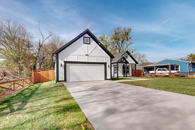 view of front of property featuring a front yard and a garage