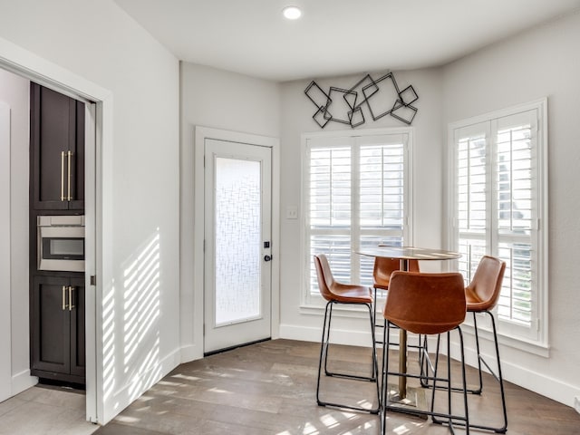 dining room featuring light hardwood / wood-style floors and a wealth of natural light