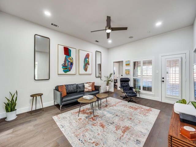 living room with ceiling fan and hardwood / wood-style floors