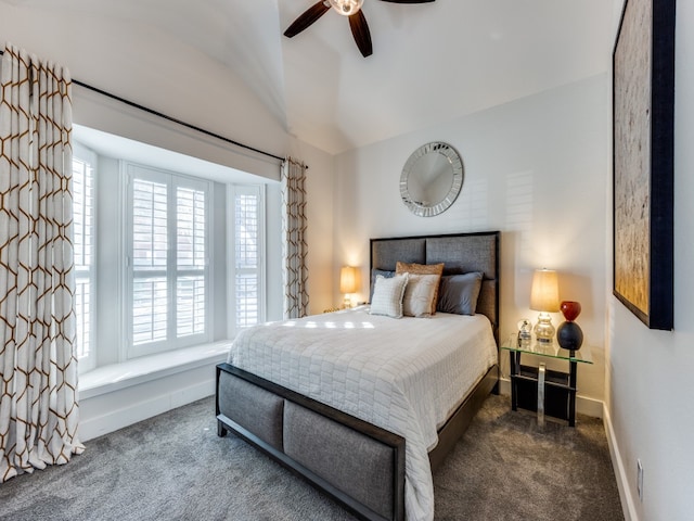 bedroom with dark colored carpet, vaulted ceiling, and ceiling fan