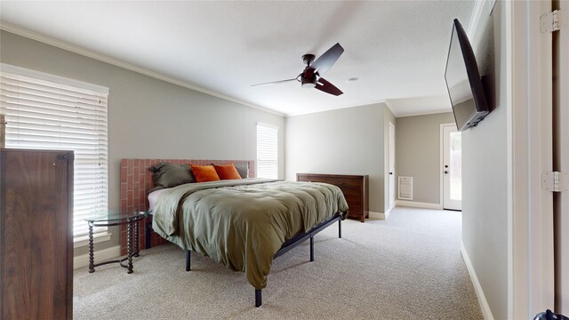 bedroom featuring crown molding, light colored carpet, and ceiling fan