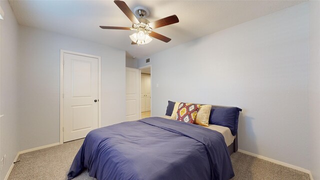 carpeted bedroom featuring ceiling fan