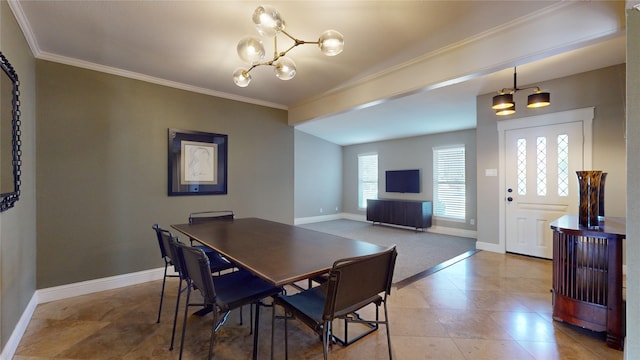 dining room with an inviting chandelier and crown molding