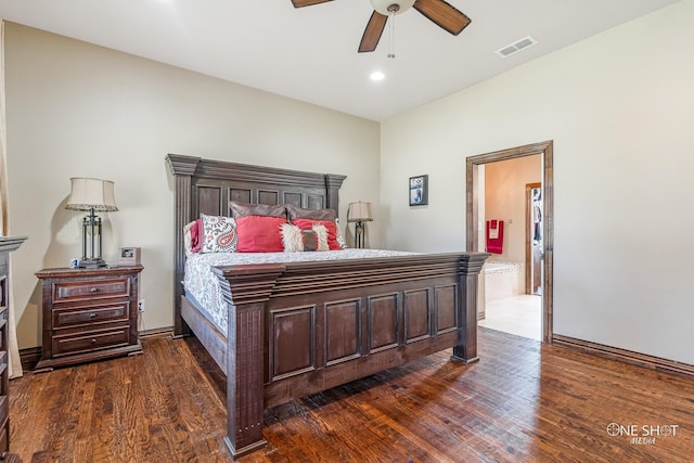 bedroom featuring ensuite bath, ceiling fan, and dark wood-type flooring