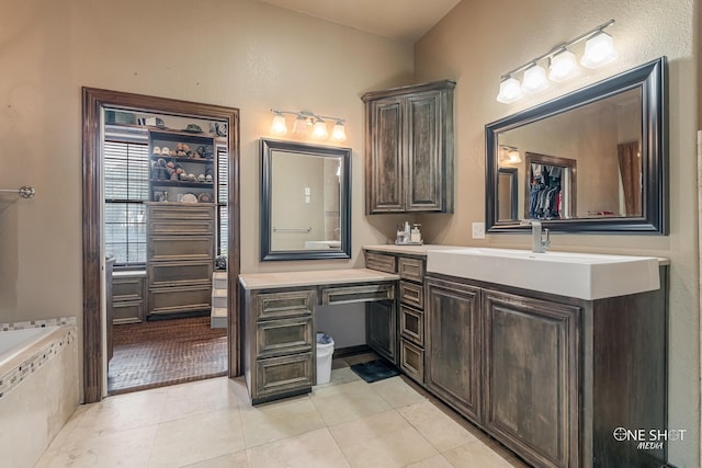 bathroom featuring tile patterned floors and vanity