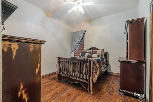 bedroom featuring ceiling fan and dark hardwood / wood-style flooring