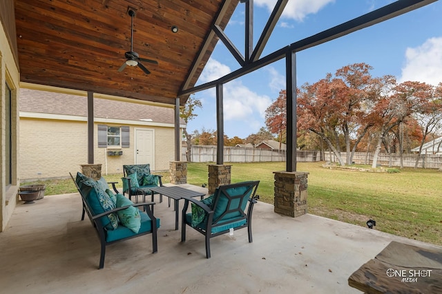 sunroom / solarium with ceiling fan, plenty of natural light, wood ceiling, and vaulted ceiling