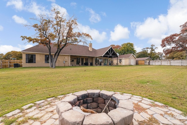 view of yard with a fire pit