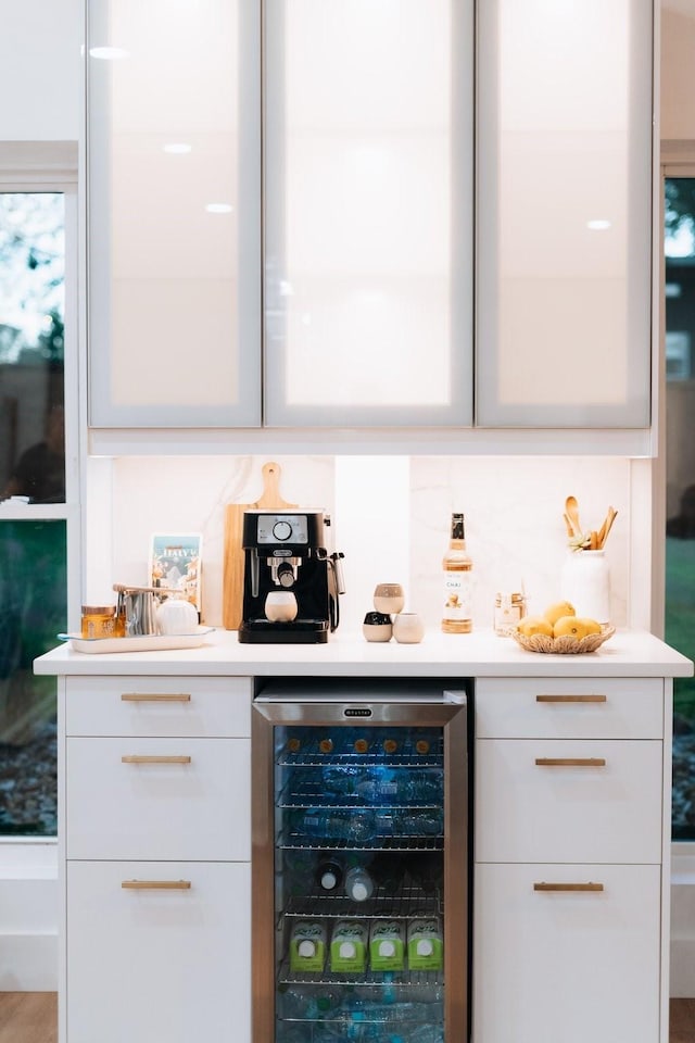 bar with a dry bar, wine cooler, and decorative backsplash