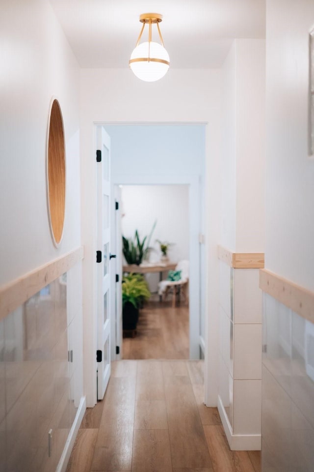 corridor featuring light wood-style flooring