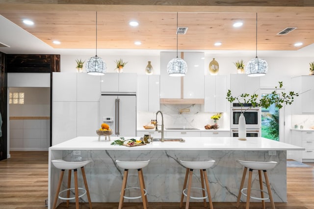 kitchen featuring white appliances, visible vents, white cabinets, wooden ceiling, and modern cabinets