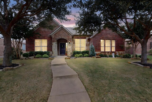 view of front of house with a lawn