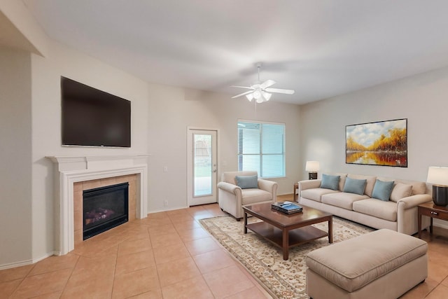 living room with ceiling fan, light tile patterned floors, and a fireplace