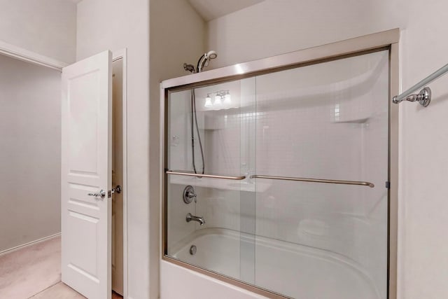 bathroom featuring bath / shower combo with glass door and tile patterned floors