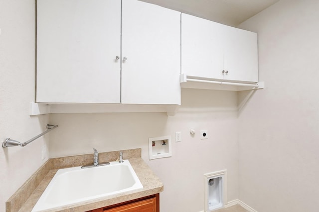 clothes washing area featuring gas dryer hookup, sink, hookup for a washing machine, cabinets, and hookup for an electric dryer