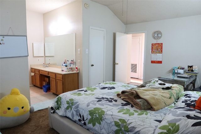 tiled bedroom featuring sink and vaulted ceiling