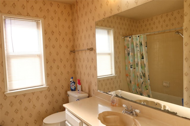 full bathroom with vanity, toilet, and shower / bath combo