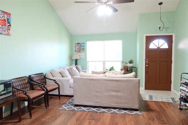 living room featuring ceiling fan, lofted ceiling, and hardwood / wood-style flooring