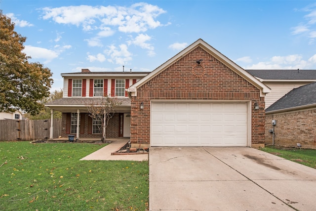 view of front property with a front yard and a garage