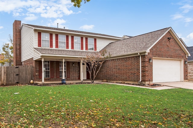 front of property with a porch, a garage, and a front lawn