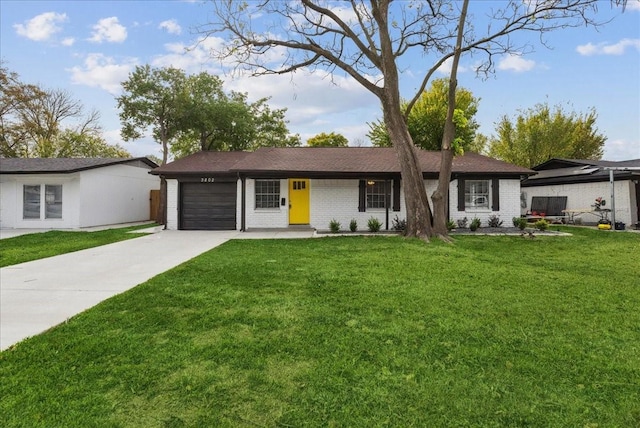 single story home featuring a front yard and a garage