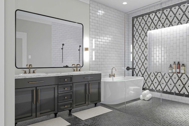 bathroom featuring tile patterned flooring, a washtub, tile walls, and vanity