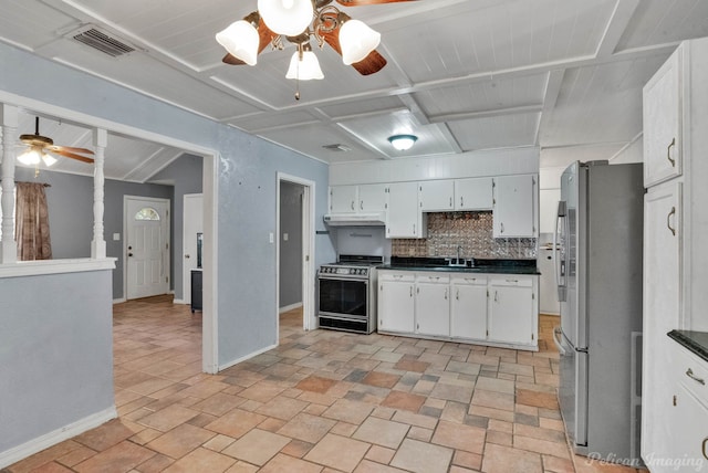 kitchen with sink, white cabinetry, appliances with stainless steel finishes, ceiling fan, and decorative backsplash