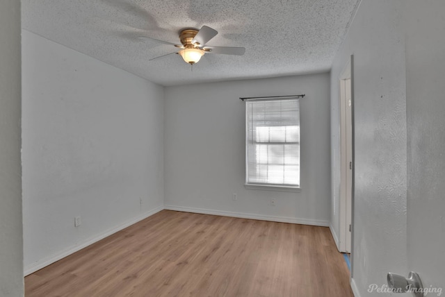 unfurnished room with ceiling fan, a textured ceiling, and light hardwood / wood-style floors