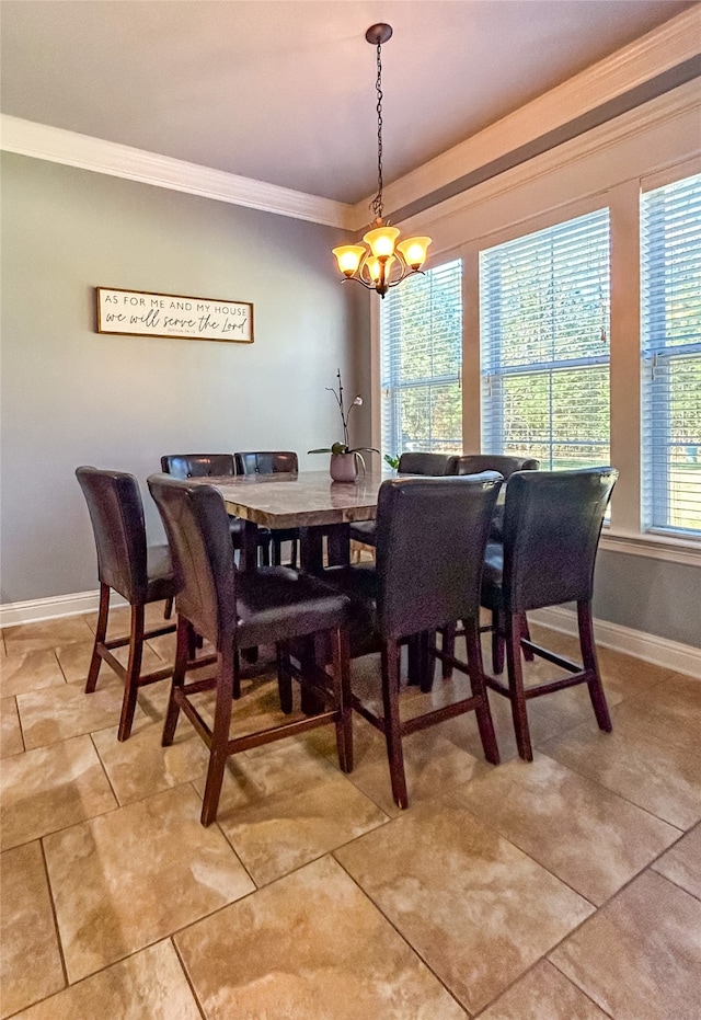 tiled dining area featuring an inviting chandelier and ornamental molding