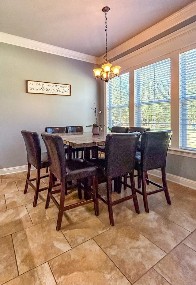 dining space with ornamental molding, a chandelier, and light tile patterned floors