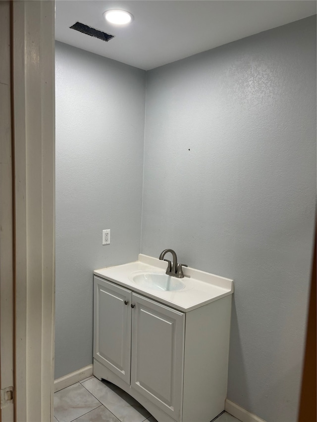 bathroom featuring tile patterned floors and vanity