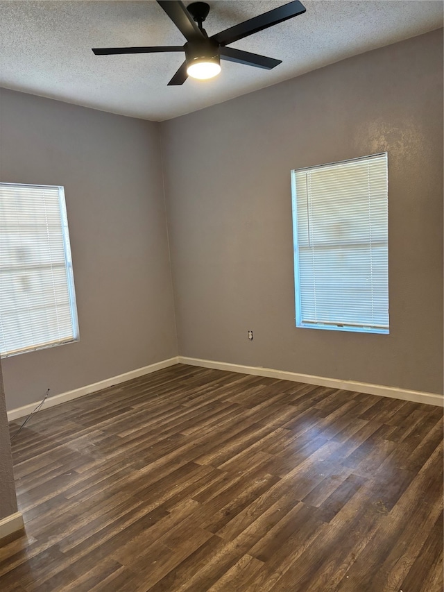 unfurnished room featuring a textured ceiling, ceiling fan, and dark hardwood / wood-style floors