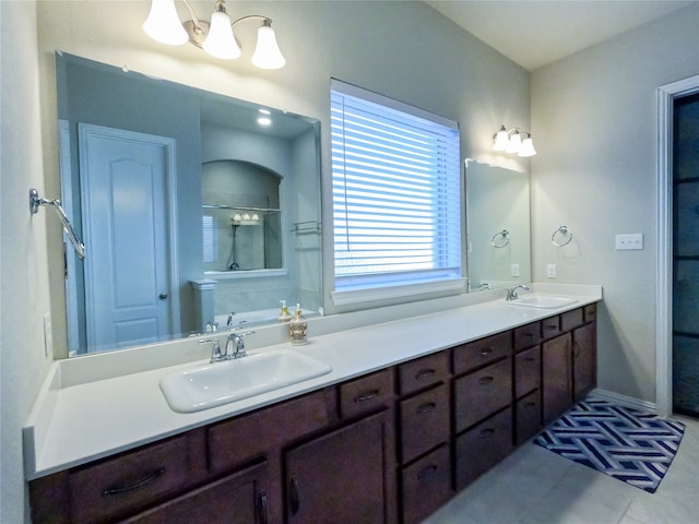 bathroom with vanity, tile patterned floors, and a shower with door